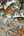 Embellish-Wallstitch-Birds-of-Paradise-Green-Orange-Gold-Wallpaper-by-design-id-DE120013